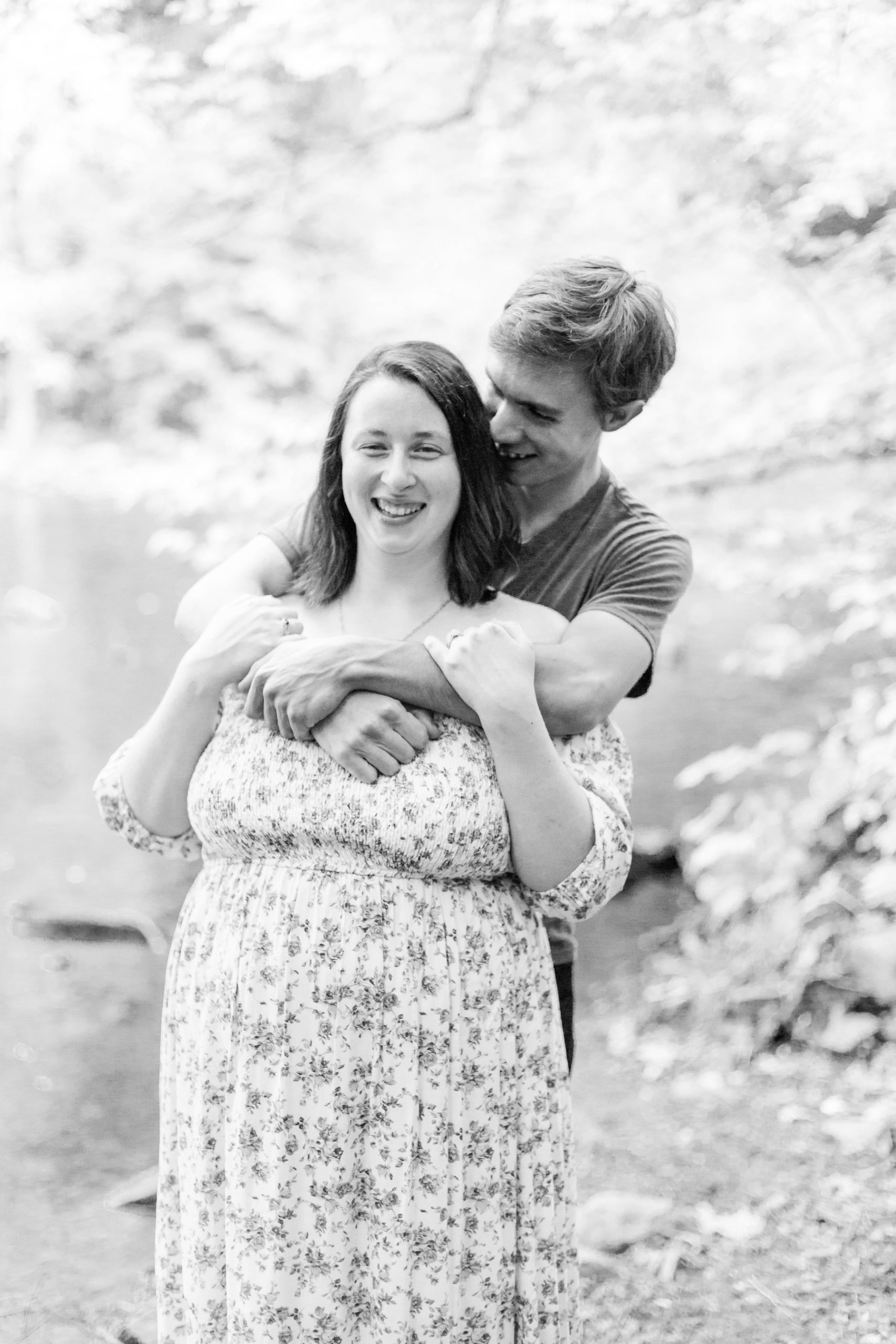 Couple laughs while hugging at Wadsworth Fall Engagement Session