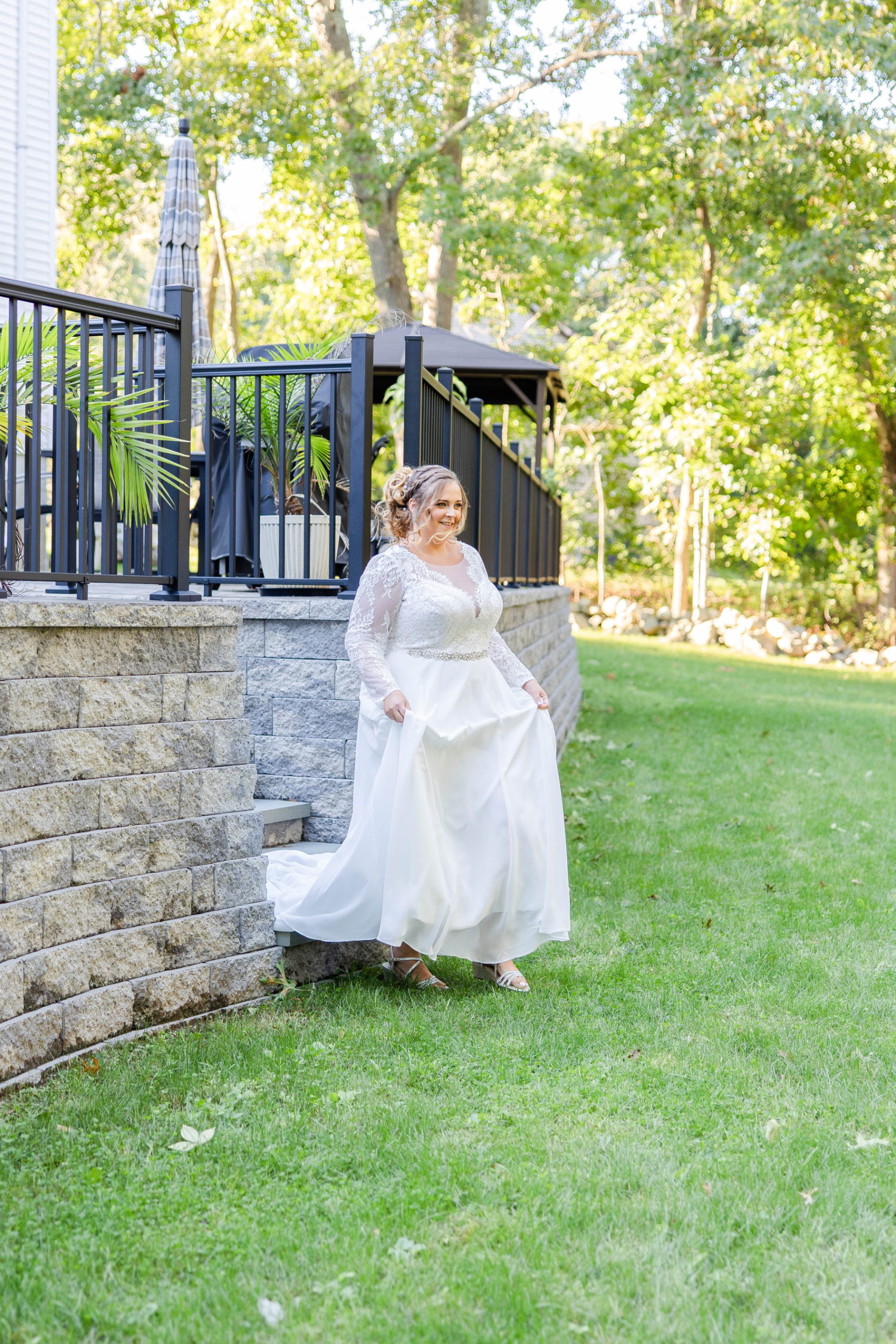 Bride walks across the lawn for first look at Great Neck Country Club Wedding