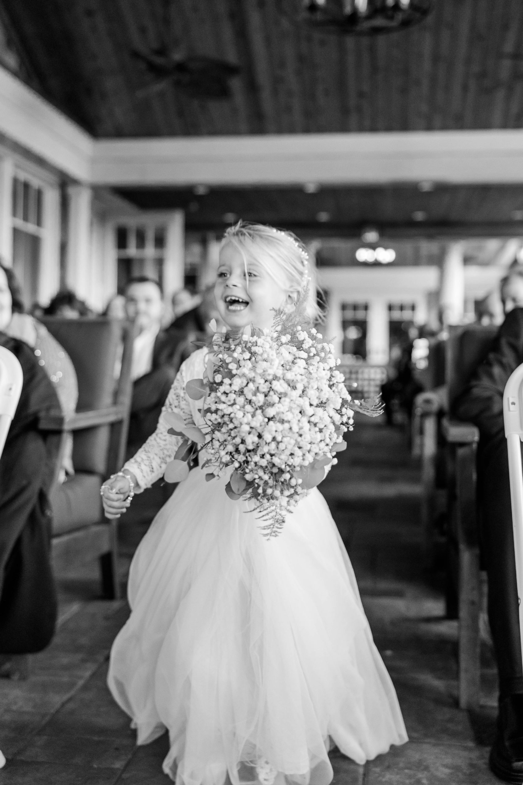 Flower Girl walks down the aisle at the ceremony at Great Neck Country Club Wedding