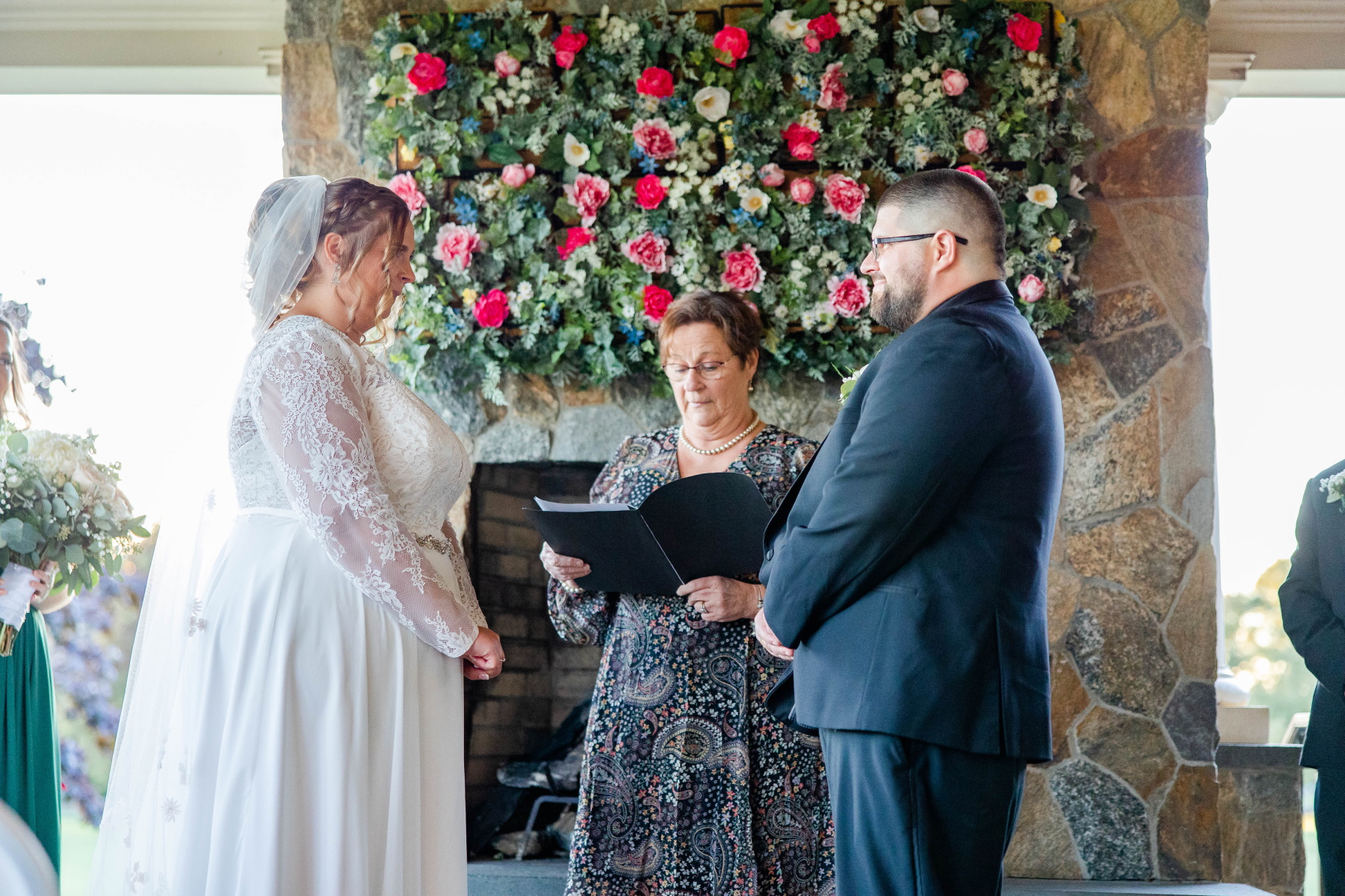 Bride and groom look lovingly at each other during ceremony at Great Neck Country Club Wedding