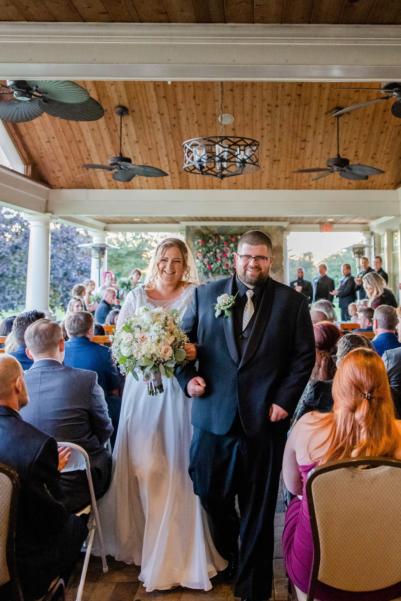 Bride and groom walk up the aisle after their ceremony at Great Neck Country Club Wedding