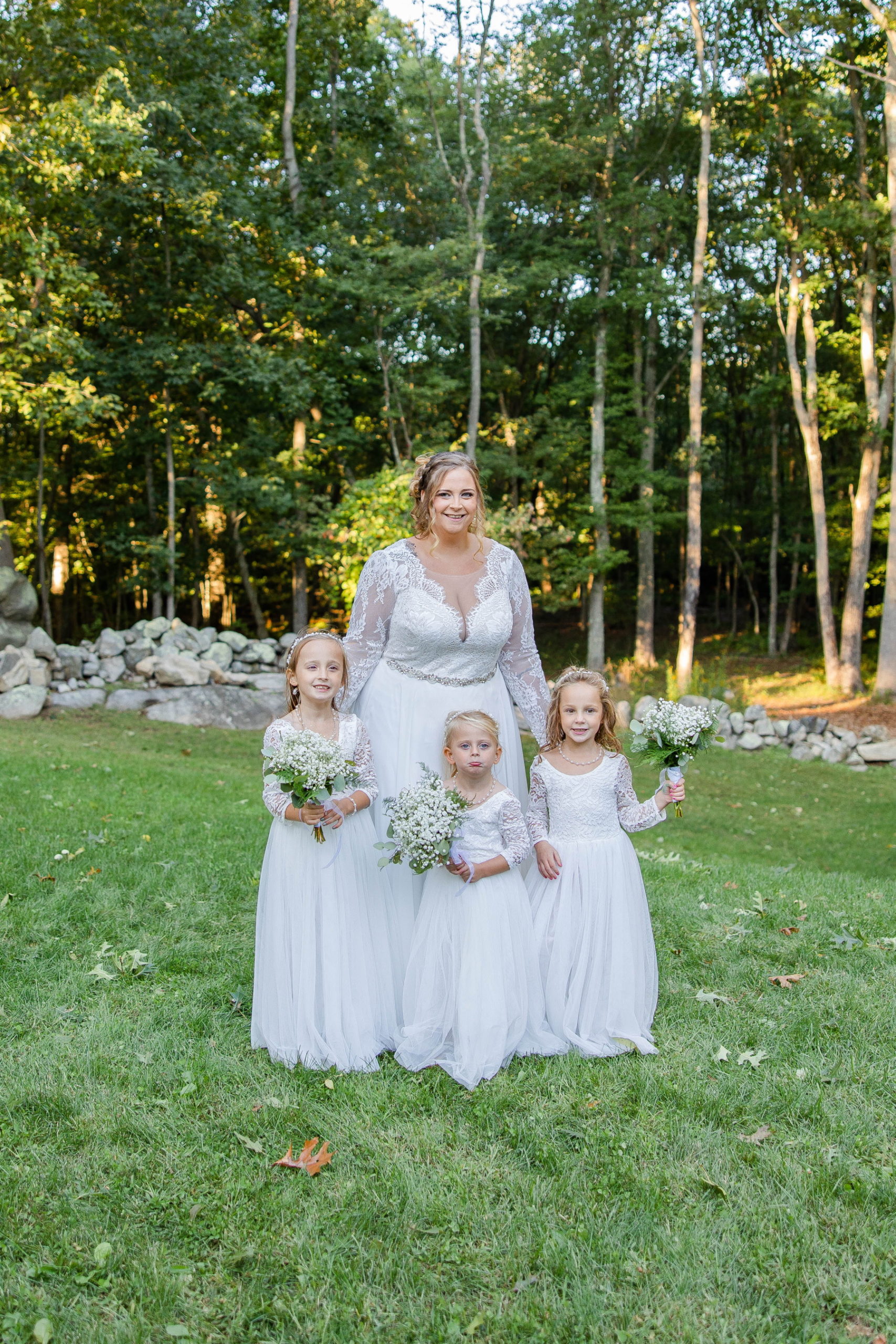 Bride and flower girls smile at camera at Great Neck Country Club Wedding