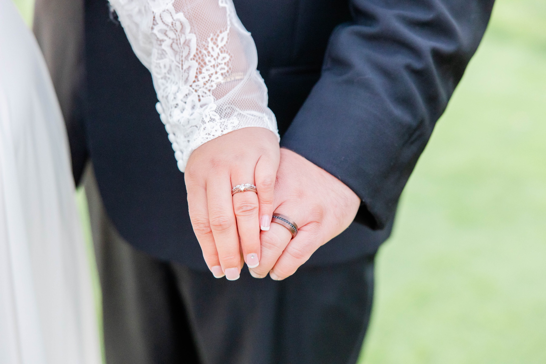 Close up of bride and groom's wedding rings at Great Neck Country Club Wedding