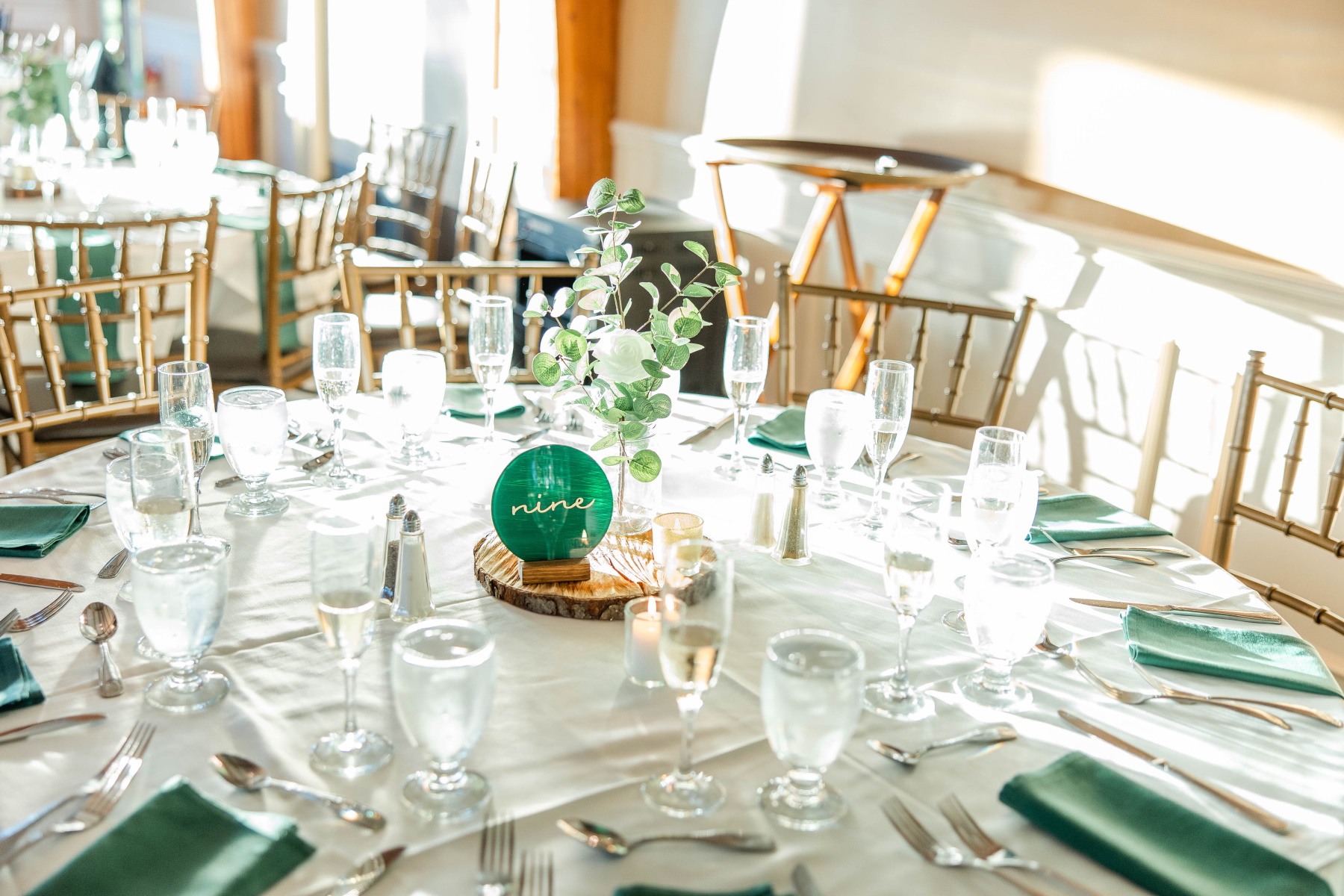 Detail photo showing the dining setup with Table Nine and Green linens and florals at Great Neck Country Club Wedding