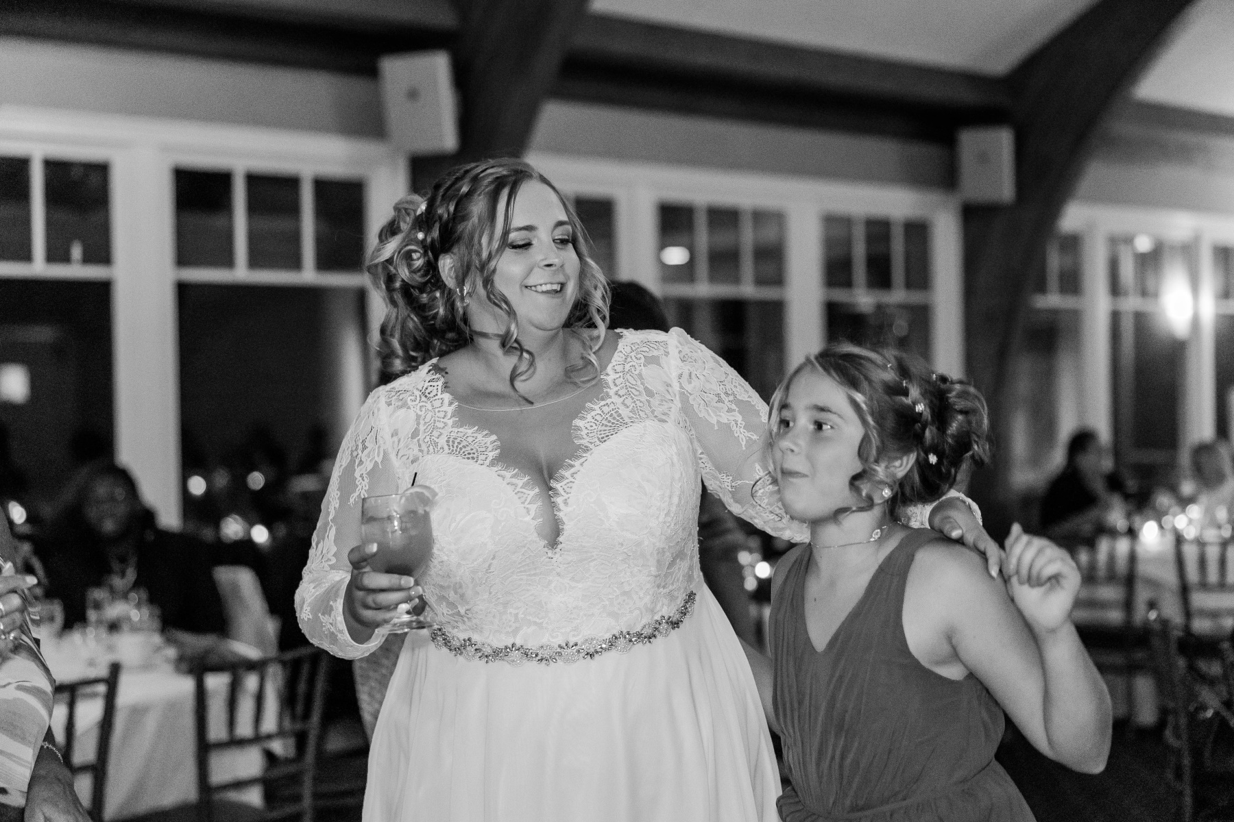 Bride dances with a junior bridesmaid at Great Neck Country Club Wedding